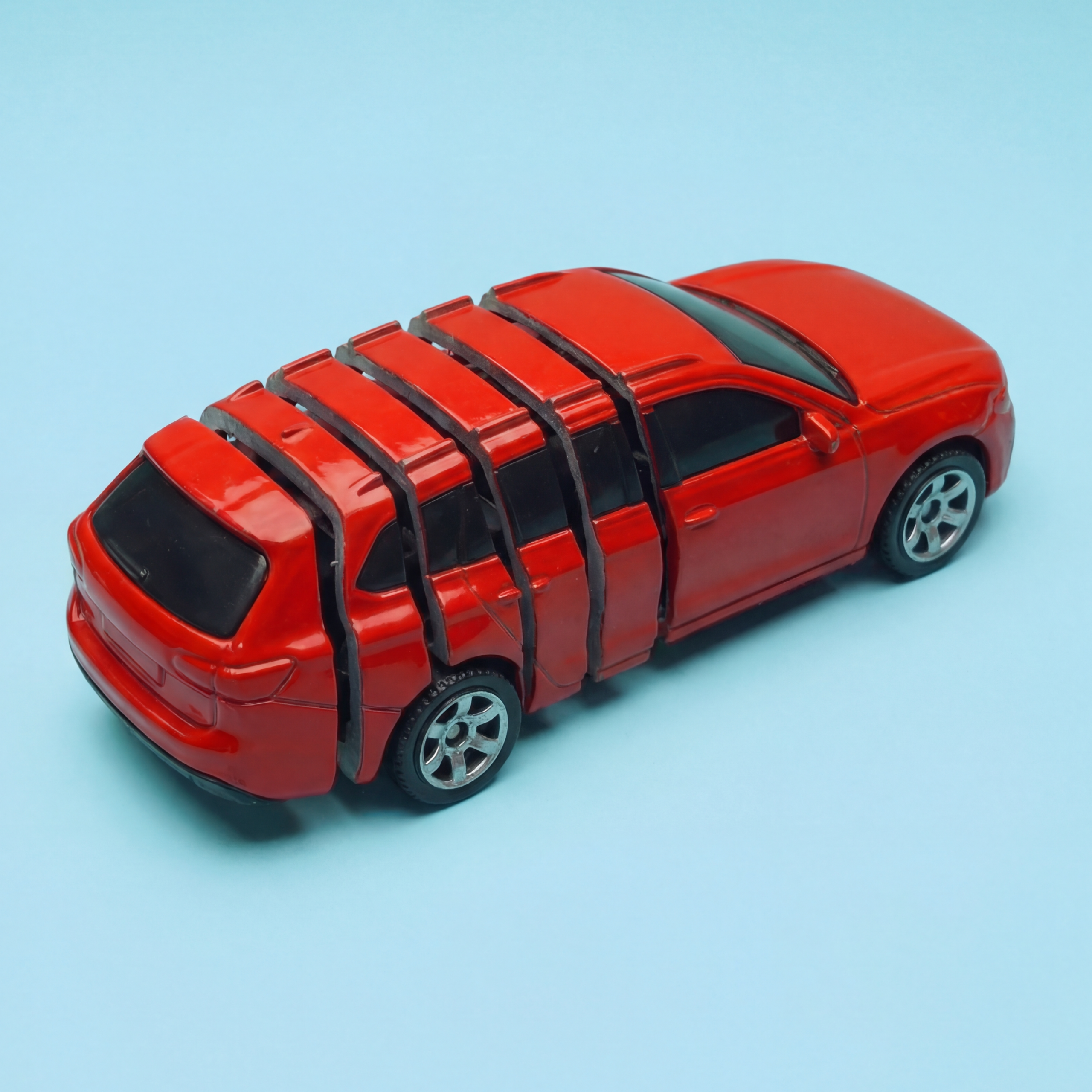 Foto van een rode auto voor een blog over het stotteren auto bij optrekken